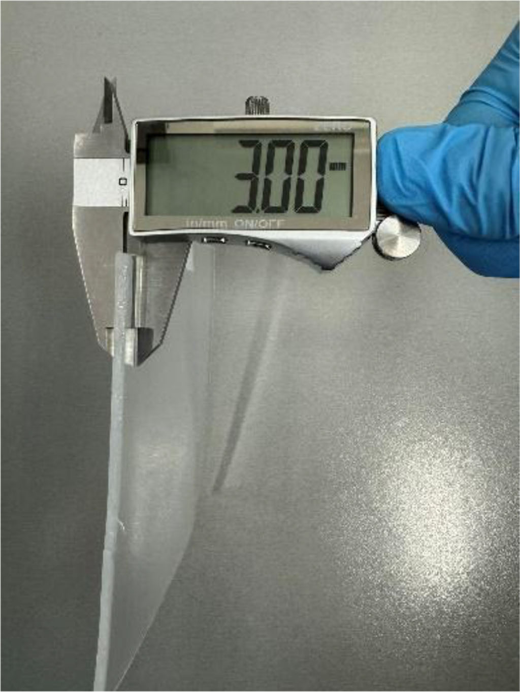 Fig.3 Measurement of thermoformable plate thickness by electronic calliper (Preciva). 