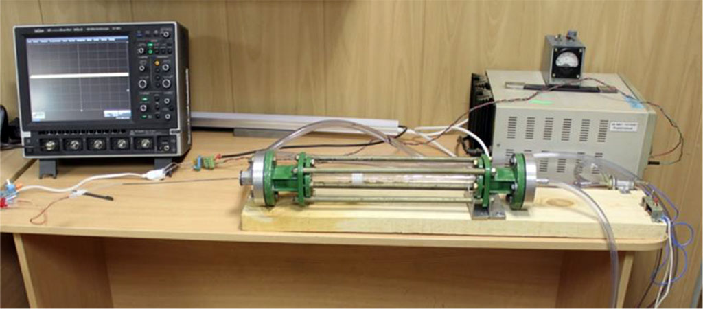 Figure 1. Device for modeling of intra-arterial circulation. Main parts: rotameter glass tube, electric water pump, oscilloscope, 12 Volt battery, silicone tubes.